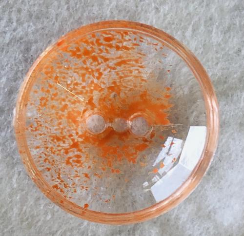 Bouton plastique transparent et orange